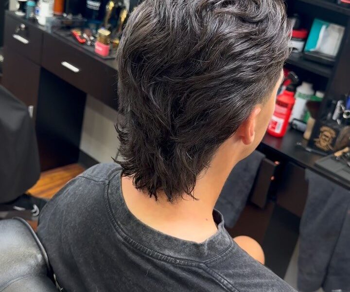 A textured, flowing scissor cut in a barber chair at Aliana Barbershop
