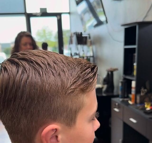 A young client's clean, finished haircut at Aliana Barbershop