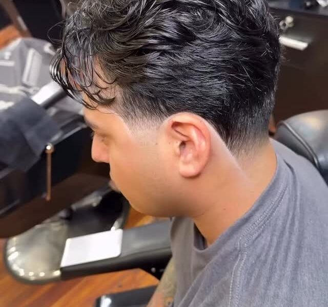 A textured crop with a clean taper at Aliana Barbershop